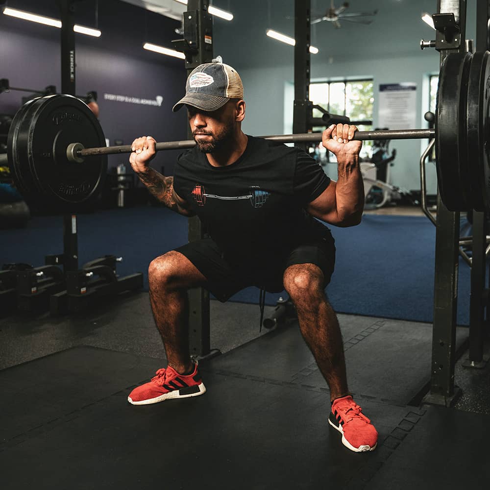 Image of a man performing squats